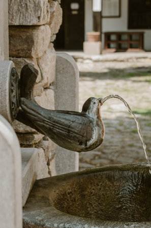 Bachkovo, Plovdiv / Bulgaria â 07/24/2022: Street drinking fountain in the form of a bird with water pouring out of its beak. Quality image for your projectのeditorial素材