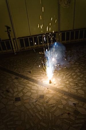 flower pot cracker flame during diwali celebration in indiaの写真素材