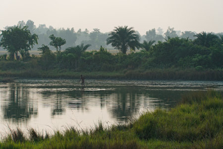 a lonely fisherman with the netの写真素材