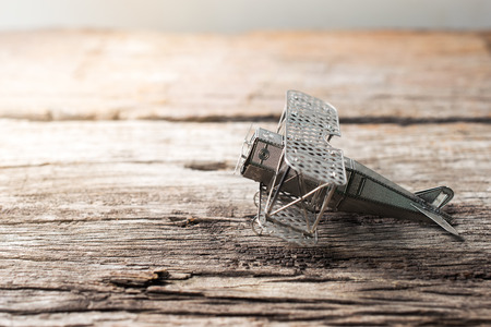 vintage aircraft fighter on wood table ready to take off.の写真素材