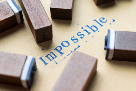 alphabet letter word impossible from stamp letters font on paper for impossible concept background