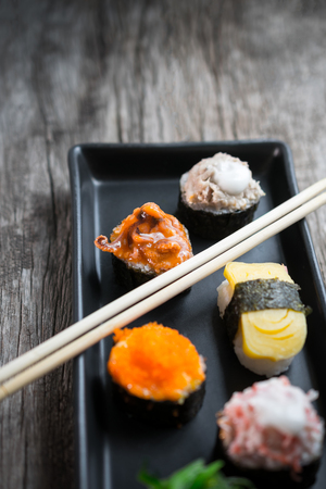 Sushi Set and sushi rolls served on wood table.の写真素材