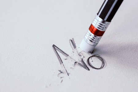 pencil erasing the word No on paper.の写真素材