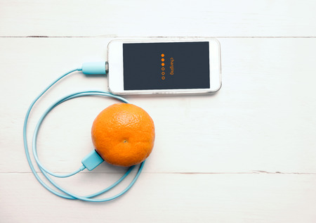 Smartphone charging battery from orange fruit, Smart and Eco - Friendly to Charge Smartphone...