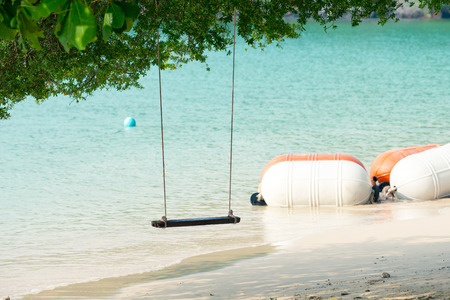 Swing near the seaの写真素材