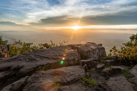 Sunset at Mountain Lake with flare from sunの写真素材
