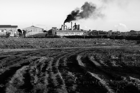 Chemical factory with smoke stack black and white toneのeditorial素材