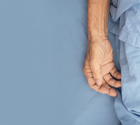 old man hand sleeping in a hospitalの写真素材