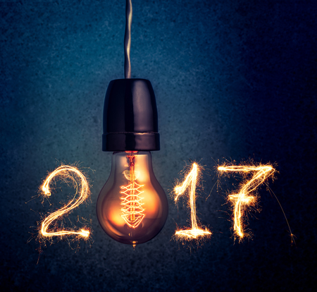 2017 written with Sparkle firework and  light bulb , abstract 2017 Happy New Year background...