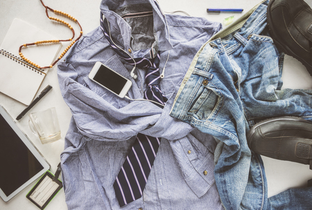 flat lay wrinkle striped shirt, Jeans, tablet, shoes and necktie, hipster man untidy man concept.の写真素材