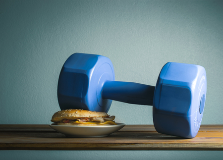 dumbbell put on hamburger idea Exercises For Weight Loss diet concept.の写真素材