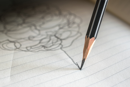 pencil draws a straight line on a paper note success concept.の写真素材