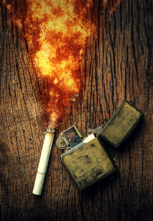 cigarette burn and lighters placed on the wooden floor. no smoking concept  backgroundの写真素材