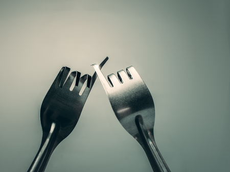 Fork hook each other promise, peace, friendship background concept.の写真素材