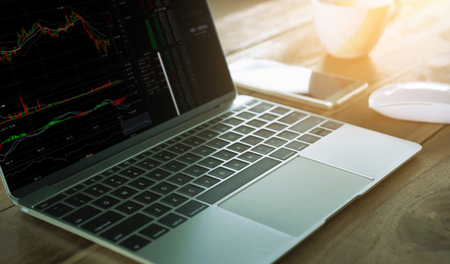 CryptoCurrency Trading laptop on work table.の写真素材