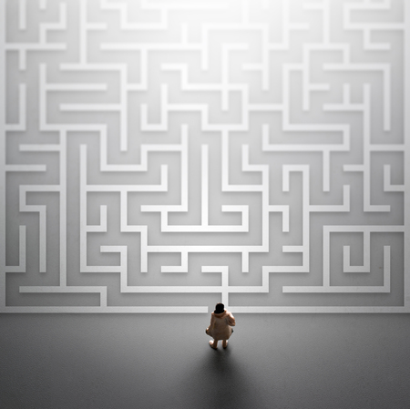 Miniature people entering a maze. Problems in Life  concept.の写真素材