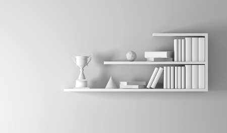 champion trophy placed on white empty interior book shelf.の写真素材