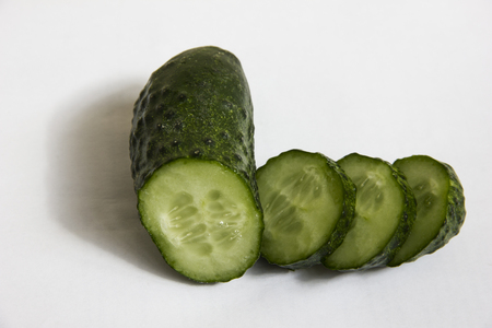 Sliced ??juicy cucumber on a white backgroundの写真素材