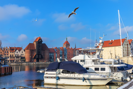 Yachts moored in the Motlawa in front of Zuraw Port Crane, Gdansk, Polandの写真素材