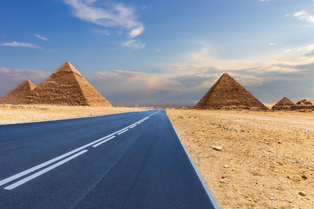 Giza Pyramids and a road in the desert, Egypt, no people.の写真素材
