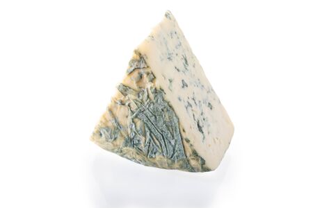 Piece of blue cheese isolated on white background.の写真素材