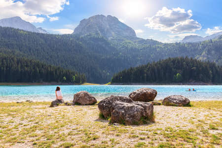 A girl near the Black Lake on Mount Durmitor, Montenegroの写真素材