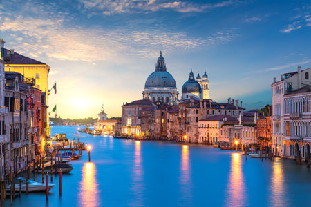 View of the Santa Maria della Salute dome in the Grand Canal at sunrise, Venice, Italyの写真素材