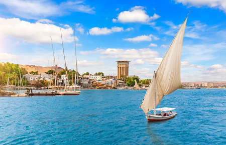 Traditional sailboats in the Nile in Aswan city, Egypt.の写真素材