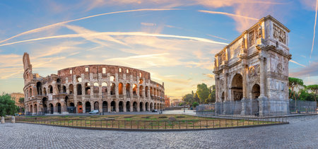 Famous Arch of Constantine and the Coliseum at sunrise, Rome. Italy.の写真素材