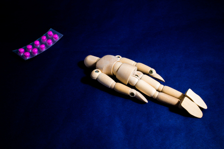 Collapsed person and drugsの写真素材