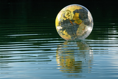 Globus ball on a lake on sunny dayの写真素材