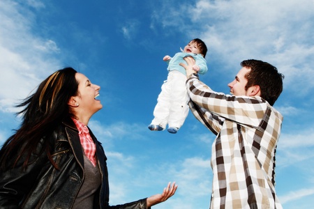 A young happy family with their 4  month old son....の写真素材