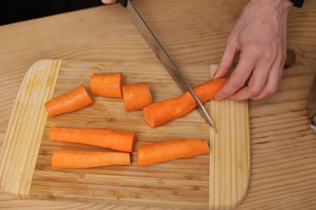 fresh carrots on a wood table in an oblique viewの写真素材
