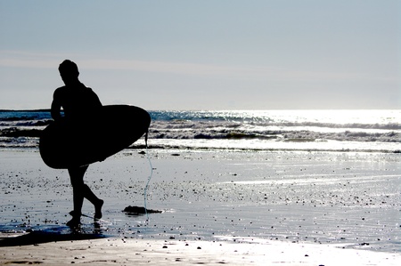 surfing at a nice beach outside at the seaの写真素材