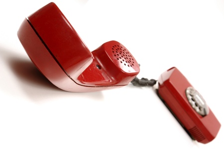 a red retro phone on white............の写真素材