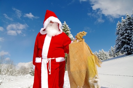 Santa Claus, Father Christmas in a beautiful winter landscapeの写真素材