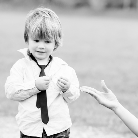 potrait of a two years old boy outdoorsの写真素材