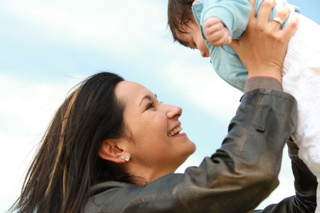 A young happy mother 22 years with her 4  month old son....