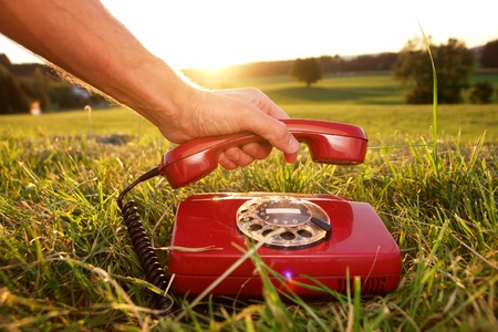 red phone in landscapeの写真素材