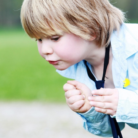 potrait of a two years old boy outdoorsの写真素材
