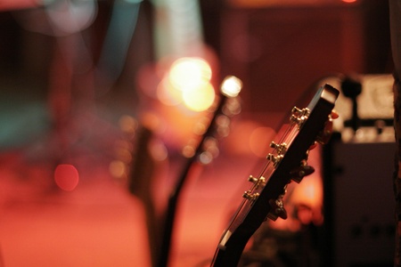 guitar on stage lot of light   の写真素材