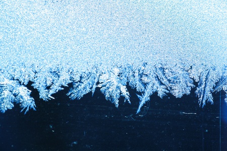 The patterns made by the frost on the window (hoarfrost background)の写真素材