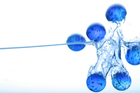 marbles falling in water water splashの写真素材