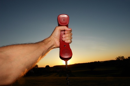 red phone in landscapeの写真素材