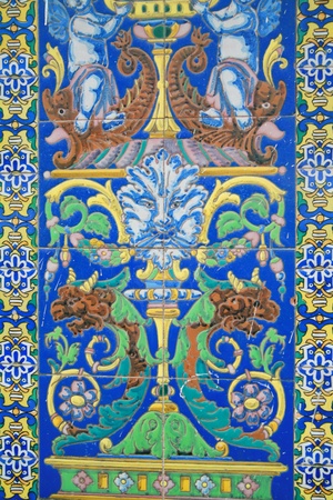 antique old tiles with ornament at a wall outsieの写真素材