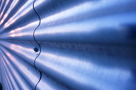 Close-up of a metalplate with wave patternの写真素材