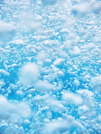 Clean blue water splash on white backgroundの写真素材