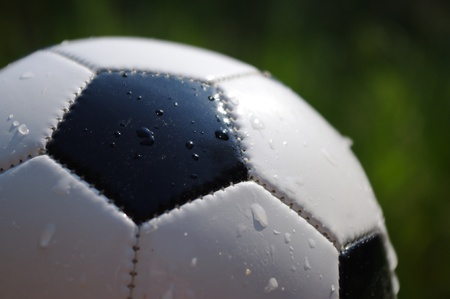 Football on grass - focus on the ball  の写真素材