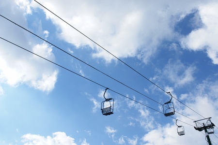 Ski lift chairs on bright winter dayの写真素材