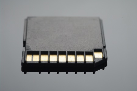 Close up on a black SD memory cards arranged over black